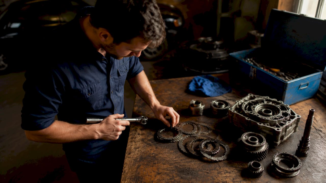 Engineer inspecting Golf R Haldex drivetrain