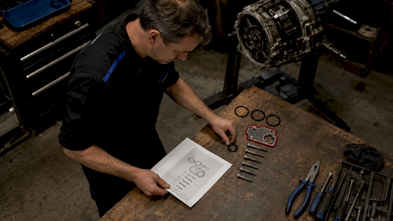Mechanic inspecting Audi Quattro service parts kit